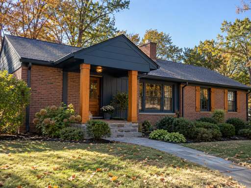 Deep navy home exterior with warm wood accents — Connecticut residential design inspiration